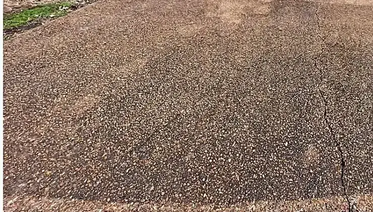 Driveway before pressure washing