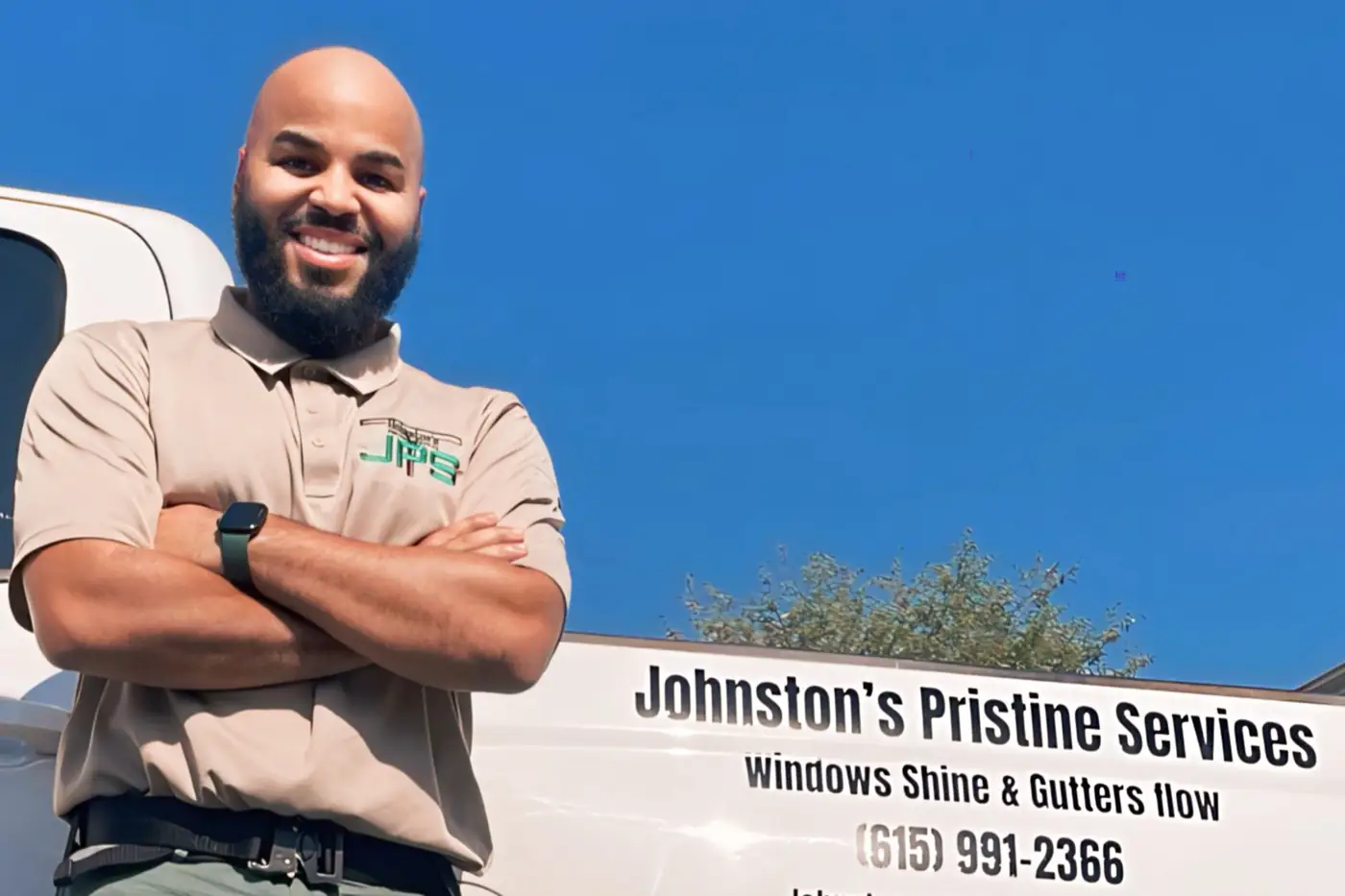 Hasan Johnston beside the JPS van